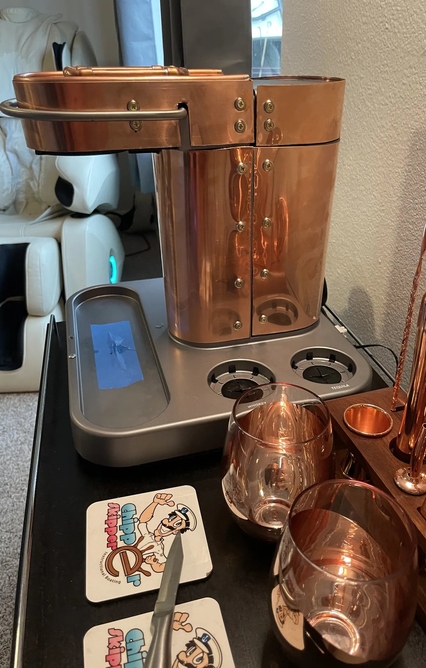 The machine part-way through the build: a new copper body riveted around the pour head, on the original base