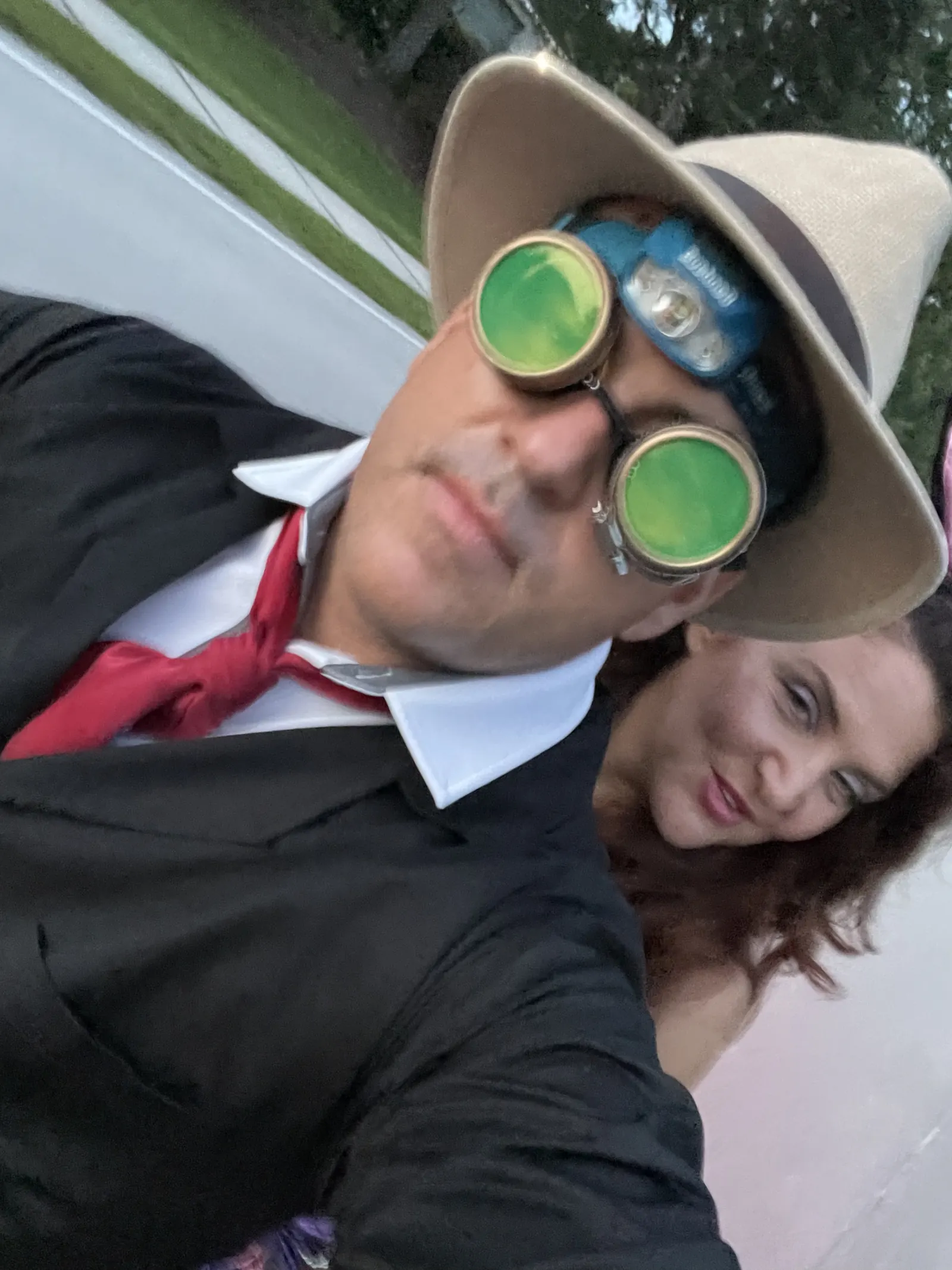 Joe dressed as Harry Craddock in fedora and green goggles, with a friend in bunny ears