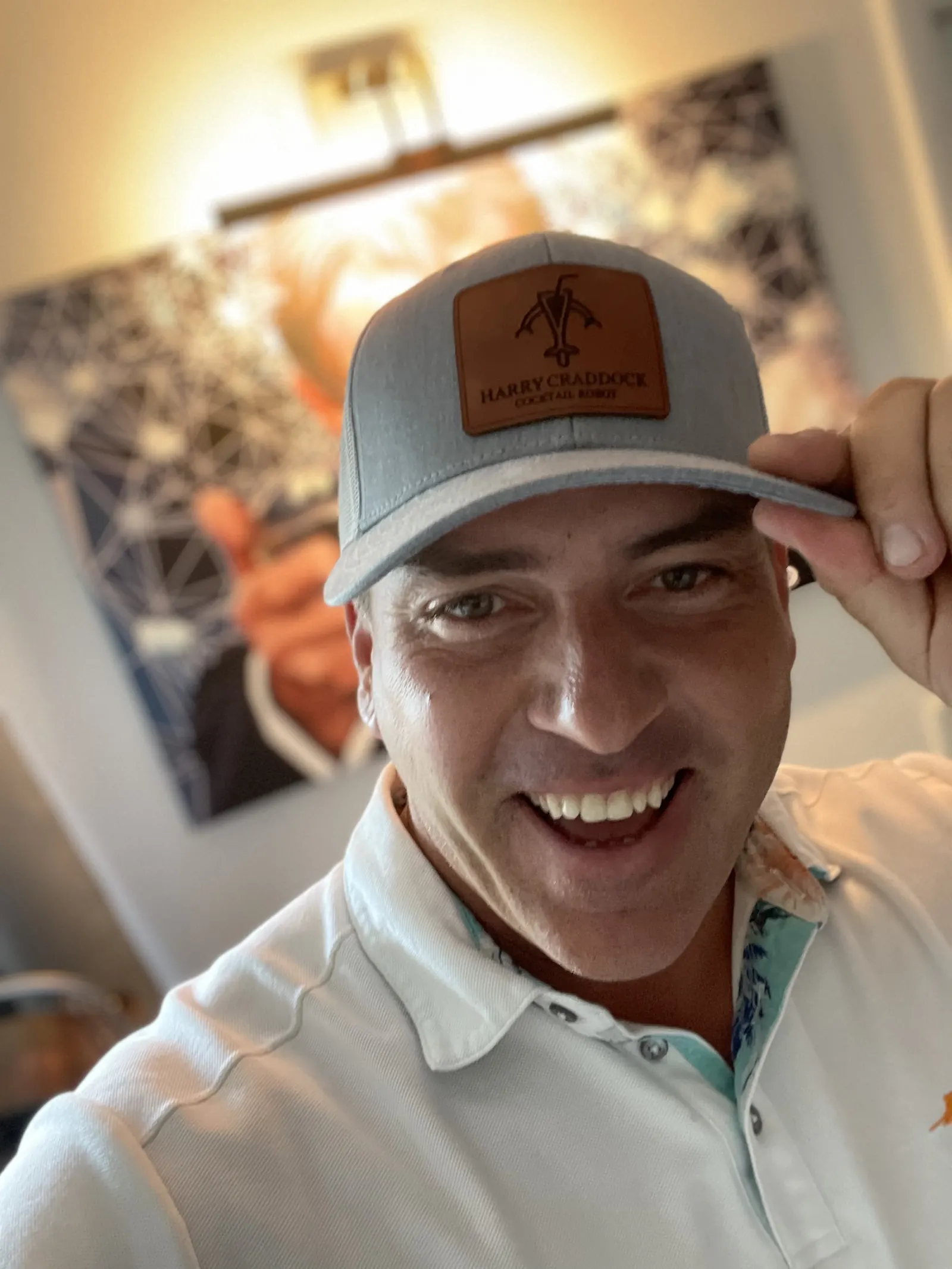 Joe smiling in a Harry Craddock Cocktail Robot ballcap