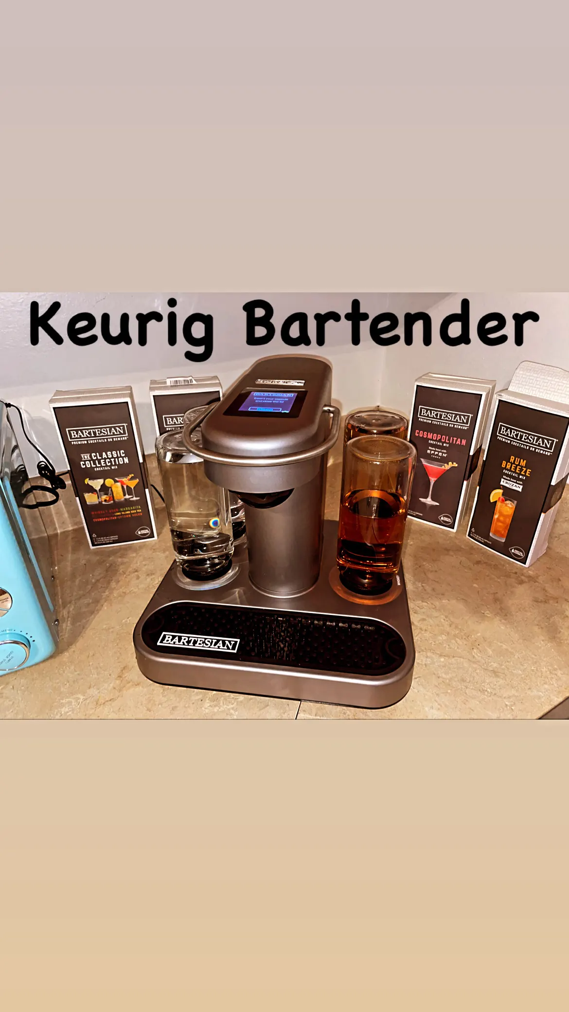The stock Bartesian on a counter with a hand-lettered sign reading Keurig Bartender