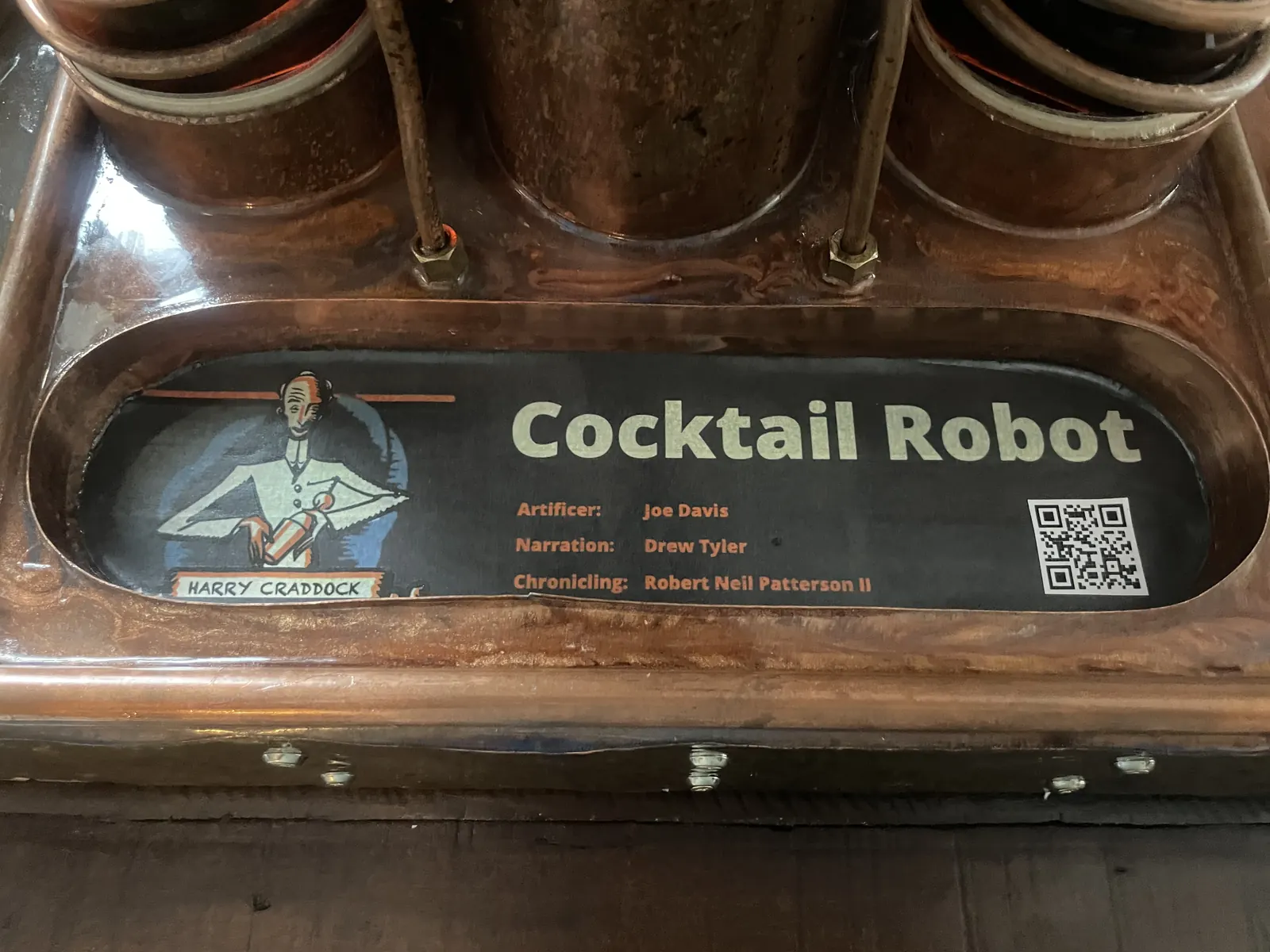The Cocktail Robot label with QR code set under the tray glass